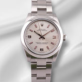 Rolex Oyster Perpetual 31mm Steel Silver Dial/Pink Markers Ladies Watch 177200